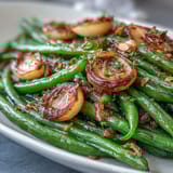 2. Oven-roasted green beans tossed with sliced garlic and olive oil, finished with a bright lemon zest for fresh flavor.  