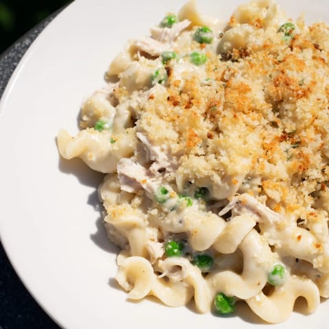 Golden baked Tuna Casserole, with a bubbly, creamy sauce and crispy breadcrumb topping ready to serve.