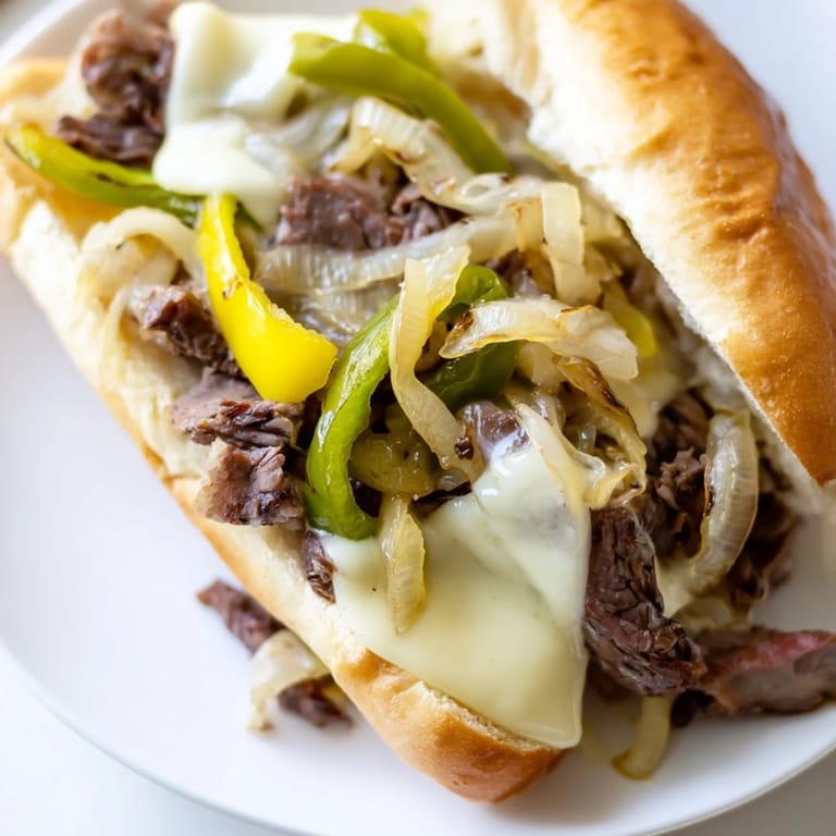 Golden-brown Philly cheesesteak, showcasing thinly sliced beef and melted cheese, ready to enjoy for dinner.