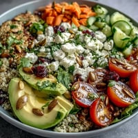Simple Grain Bowl with colorful roasted vegetables, protein-rich chickpeas, and creamy avocado slices in a nourishing bowl.